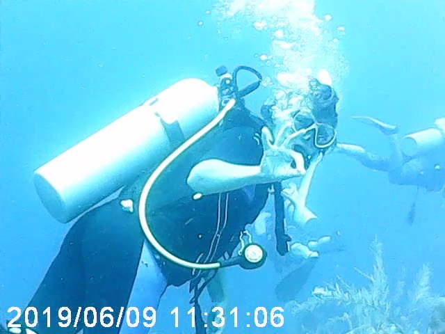 Heather flashing the diver OK